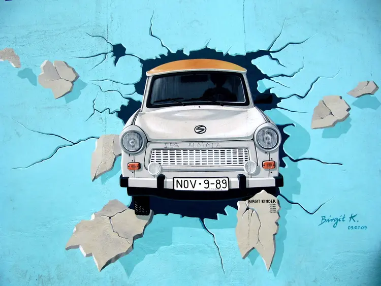 Trabant breaking through the wall painted by Birgit Kinder