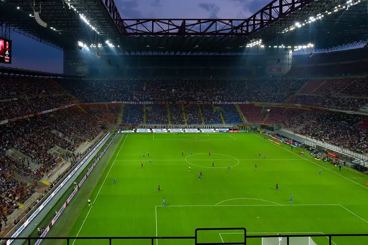 San Siro Stadium provides a vibrant match day atmosphere, more so under lights